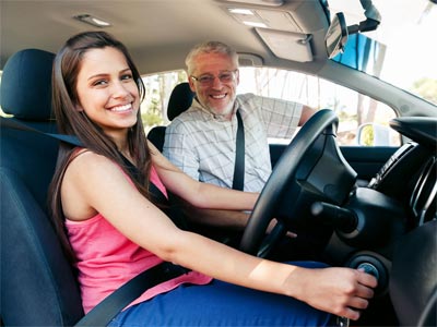 New driver with driving school instructor
